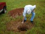 Henry almost loses the shovel in the hole